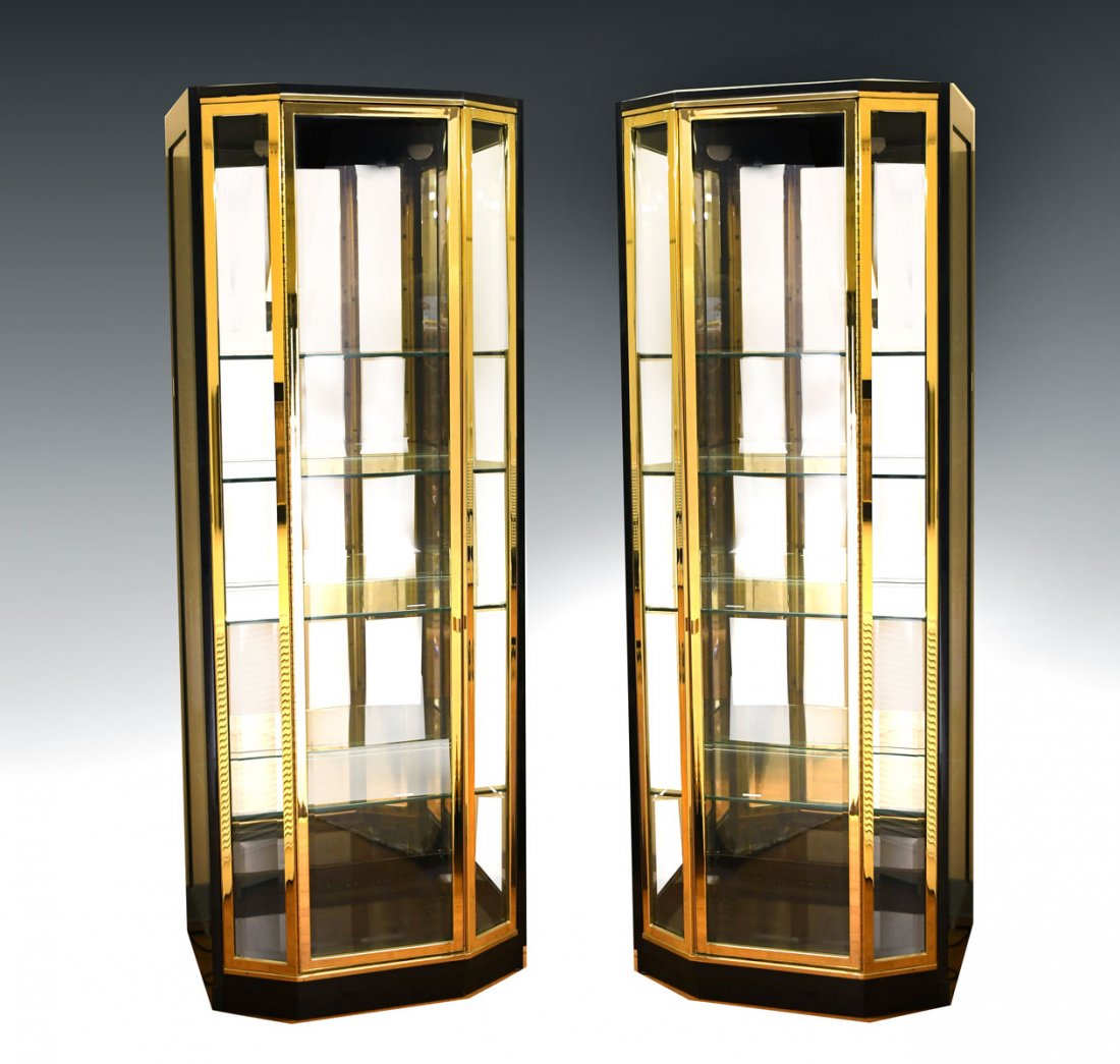 PAIR OF HENREDON LIGHTED DISPLAY CABINETS: PAIR OF HENREDON LIGHTED DISPLAY CABINETS: Pair of Henredon ebonized 4- shelf, 2- light display cabinets with brass accents. Approx. 82.25" h x 30.25" l x 22" w.