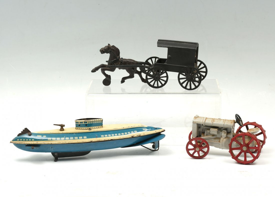 3 PIECE METAL TOY COLLECTION: 3 PIECE METAL TOY COLLECTION: Comprising; 1- Wolverine tin litho submarine, in good working condition. 1- Cast iron Amish horse & buggy. 1- Cast metal Fordson tractor.