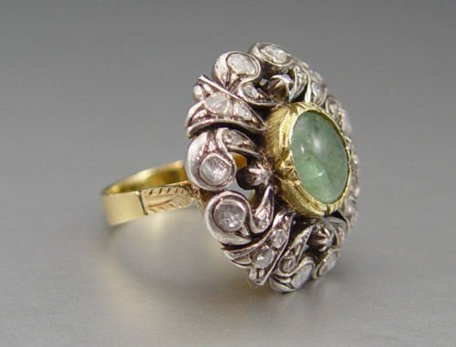 ANTIQUE ROSE CUT DIAMOND & BERYL RING 14k AND SILVE: ANTIQUE ROSE CUT DIAMOND RING, CA. MID 1800'S: 18 Ct yellow gold ring, the diamonds are set in sterling. A single oval cabochon beryl framed by 28 rose cut diamonds, approx. .75 Ctw, averaging I2 in c
