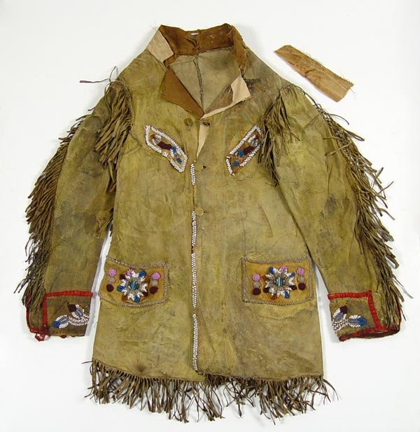 BEADED DEERSKIN JACKET attrib. BUFFALO BILL CODY: WOODLANDS BEADED DEERSKIN JACKET attrib. BUFFALO BILL CODY: Circa 1880's Woodland Indian beaded deerskin jacket attributed to being presented by W. F. Cody. Hand written inside collar piece ''Presente