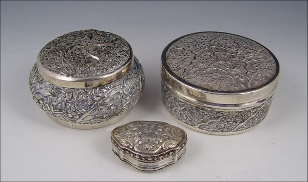 COLLECTION OF 3 SILVER REPOUSSE BOXES: COLLECTION OF 3 SILVER REPOUSSE BOXES: To include 1) Turkish 900 silver with floral design and lid. 2 1/4" h x 4" dia. 2) 800 silver with floral design and lid. 2 1/2" h. x 4 1/4" 3) Hinged snuff or p