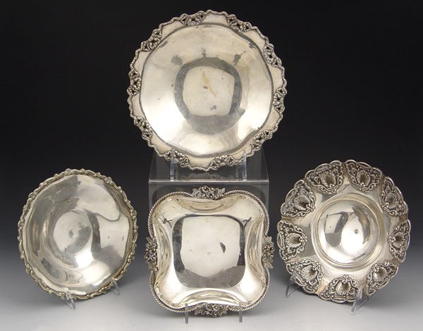 COLLECTION OF 4 FOOTED SILVER CANDY DISHES: COLLECTION OF 4 FOOTED SILVER TRAYS: To include 1) Sterling candy or nut dish with floral and rope rim. on 4 feet. 1 1/4" x 6 3/8 square. 2) 800 silver Feyzullzan maker, garland decorated rim on 3 fee