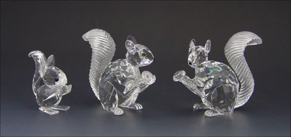 SWAROVSKI CRYSTAL 3 SQUIRRELS: 3 SWAROVSKI CRYSTAL SQUIRRELS: "Woodland Friends" 1985 Squirrel with large ears, 1 3/4". Two 1997 SCS 10th Anniversary Squirrels, A.E. Closed 1997, each with black mirror base, 2 3/4". All have boxes.