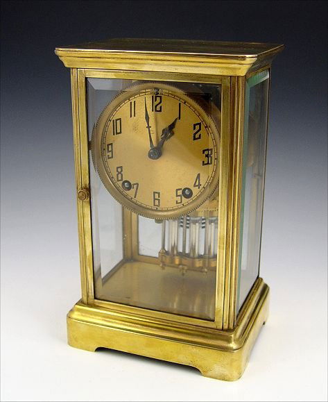 FRENCH CRYSTAL REGULATOR CLOCK: FRENCH CRYSTAL REGULATOR CLOCK: Brass case with beveled glass sides (note one side replaced with plastic). Unmarked as to maker. Key and pendulum movement, faux mercury pendulum. Measures 10" h. x 6 1