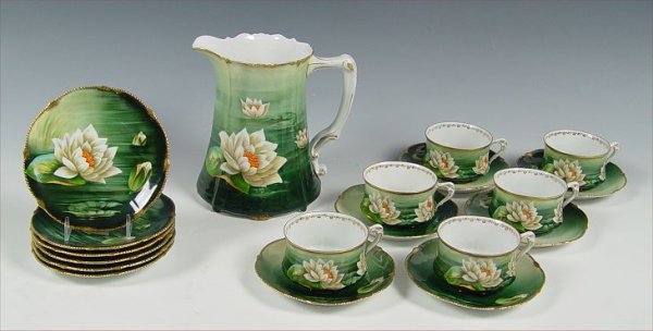HAND PAINTED BAVARIAN CIDER AND DESSERT SET: HAND PAINTED BAVARIAN CIDER AND DESSERT SET: Hand painted water lily design on pitcher (7 3/4"), 6 cups and saucers and 6 cake plates.