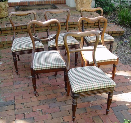 SET OF 6 COUNTRY WALNUT DINING CHAIRS: SET OF 6 COUNTRY WALNUT DINING CHAIRS: Simple rounded open heart shape backs. The two head chairs have simple carvings. All with reeded legs. Upholstered seats. 33" tall x 18 1/2" wide x 21" deep.