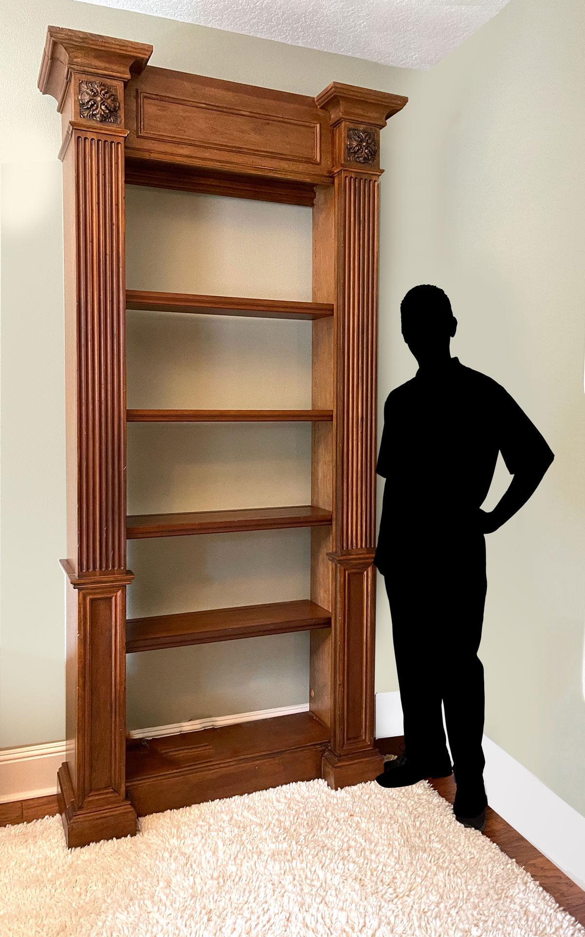 TALL MODERN 4 SHELF LIGHTED BOOKCASE: TALL MODERN 4 SHELF LIGHTED BOOKCASE: Large bookcase, having 4 adjustable shelves, flanked by fluted columns, surmounted by high relief floral medallions. 2 lights, having a touch sensitive switch. Ap