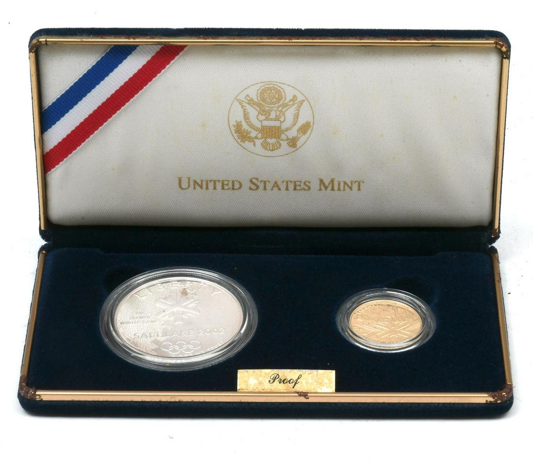 2002 OLYMPIC WINTER GAMES COMMEMORATIVE COINS: 2002 OLYMPIC WINTER GAMES COMMEMORATIVE COINS: Proof set comprising; 1- Gold Five dollar commemorative coin, & 1- Silver dollar commemorative coin. Both reside in plastic cases in a presentation box. 