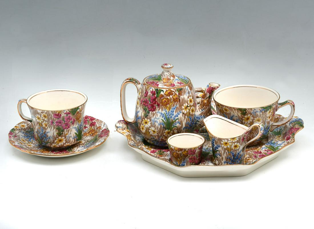 7 PC. ROYAL WINTON ''MARGUERITE'' PATTERN CHINTZ CHI: 7 PC. ROYAL WINTON ''MARGUERITE'' PATTERN CHINTZ CHINA: Breakfast set. Comprising; 1- Teapot, 2- Cups, 1- Sugar, 1- Creamer, 1- Saucer, & 1- Serving tray with toast/napkin holder. Largest Approx. 1.25