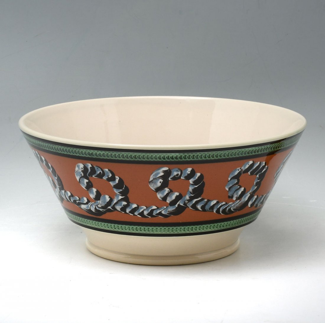 DON CARPENTIER MOCHA WARE BOWL: DON CARPENTIER MOCHA WARE BOWL: Having an encompassing earthworm design with impressed spiraling bands. Impressed marks at underside. Approx. 4.75" h x 10.25" w.