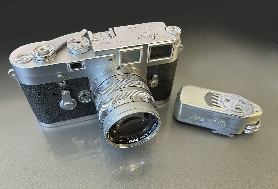 LEICA M3 CAMERA WITH CASE AND LEICA METER: LEICA M3 CAMERA WITH CASE AND LEICA METER: Serial #953-295 Leitz Wetzlar German Leica M3, circa1959. In leather case. Leice light meter attached. Approx. 5" h x 6.75" l x 4" w.