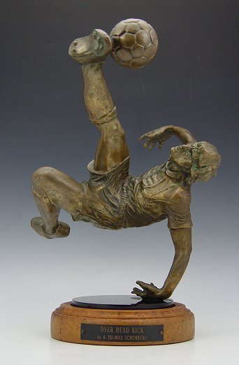 A.T. SCHOMBERG BRONZE SOCCER PLAYER: SCHOMBERG, Auldwin Thomas, (American, 1943-): Soccer Player Bronze "Overhead Kick", 17" h x 9". From the Dr. Andrew Haraway Collection. Sports Illustrated deemed A. Thomas Schomberg as "perhaps the be