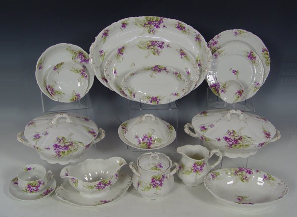 93 pc WEIMAR GERMAN VIOLET DECORATED CHINA : VIOLET DECORATED GERMAN CHINA SERVICE FOR 12 BY WEIMAR: Approx. 93 pieces to include 12 each of dinner plates, salad plates, soup bowls, dessert bowls, cups and saucers. Serving pieces are the gravy, 