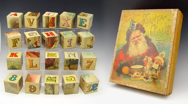 1897 MCLOUGHLIN BROTHERS SANTA CLAUS CUBE PUZZLE: 1897 MCLOUGHLIN BROTHERS SANTA CLAUS CUBE PUZZLE: Titled ''Santa Claus Travels, Santa = Claus'' With original box. All pieces present. 3'' x 13 1/2'' x 10 3/4''.