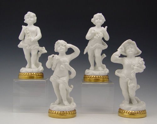 FOUR SEASONS PORTUGUESE PORCELAIN FIGURINES: 4 PORTUGUESE BLANC DE CHINE PUTTI FIGURINES: Representing the four seasons, 7''H.