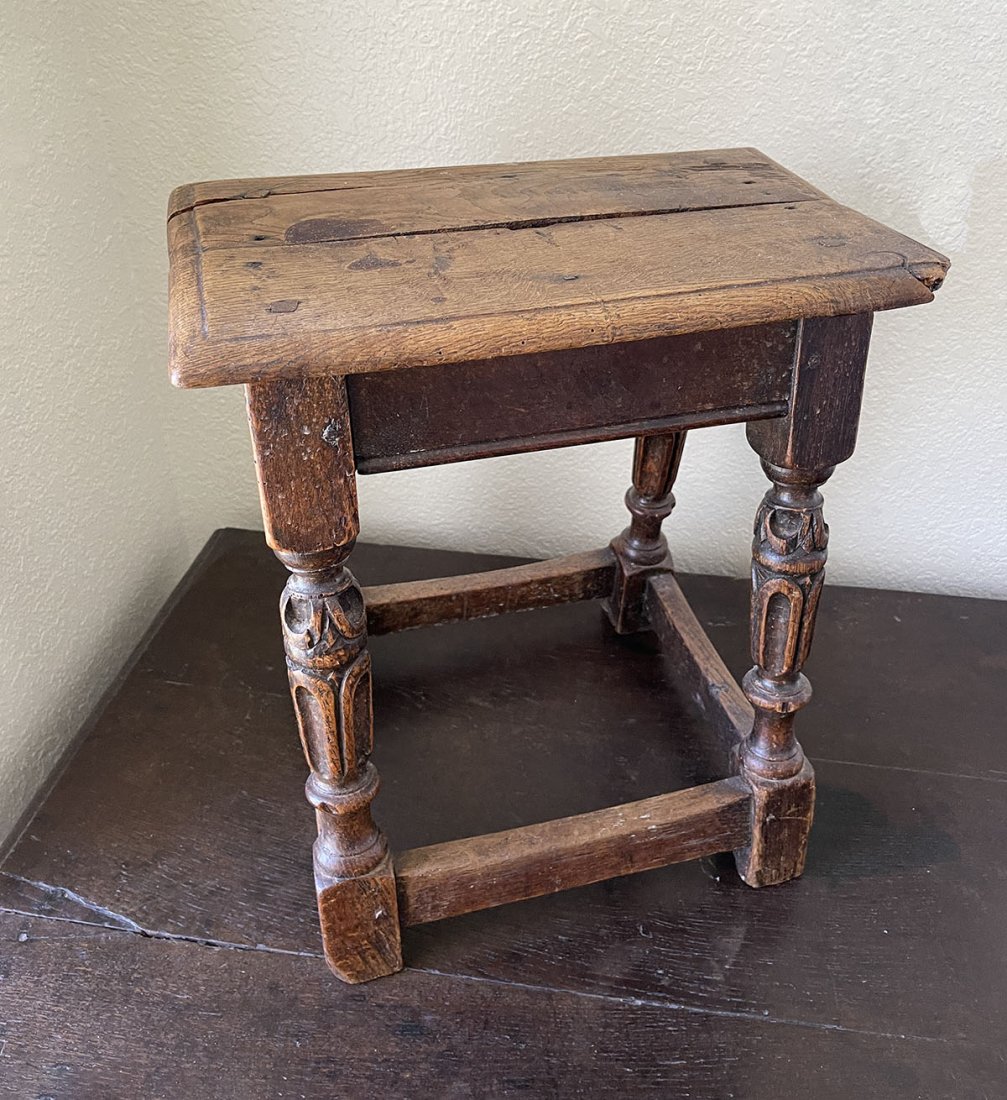 CHARLES II OAK JOINT STOOL: CHARLES II OAK JOINT STOOL: Wood peg construction, carved legs, square stretcher. Approx. 18.25" h x 16.75" l x 13" w.