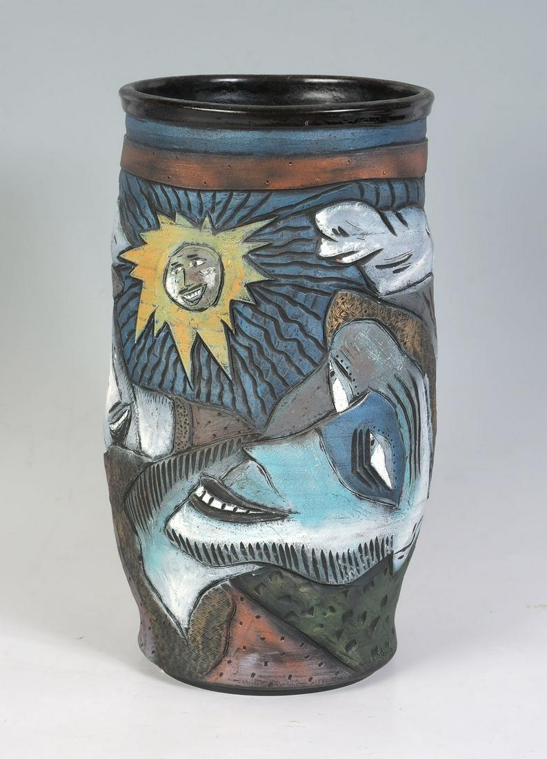 DAVID STABLEY ART POTTERY VASE: DAVID STABLEY TALL 2 FACE ART POTTERY VASE: 13.5'' h vase with a smiling sun above 2 smiling faces. Signed at the base and dated 19935. Stabley's pieces can sell for $2000 or more. Stabley works in cl