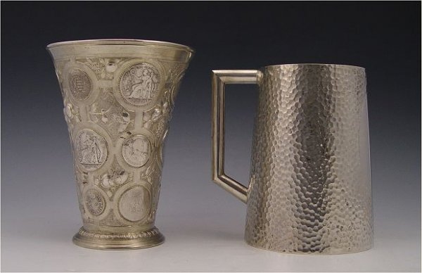 GERMAN SILVER MUG AND COIN CHALICE: GERMAN SILVER MUG AND COIN CHALICE: To include 1) E.L. Veitor hand stippled design mug with medallion for engraved dedication. German 800 silver. 6'' x 5 3/4'' overall. 2) Unknown Prussian maker 800 s