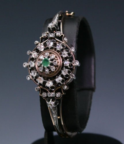 EDWARDIAN ROSE CUT DIAMOND BANGLE BRACELET: EDWARDIAN ROSE CUT DIAMOND BANGLE BRACELET: 14K yellow gold and sterling silver bangle bracelet contains forty four irregular shaped rose cut diamonds, approx. 1.00 Ct. The diamonds average SI in clar