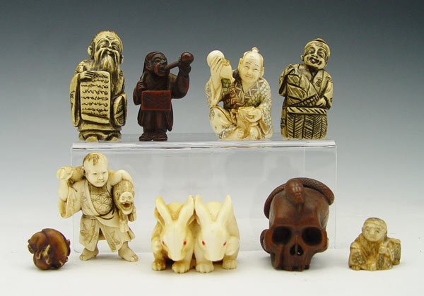 COLLECTION OF 9 IVORY & ROSEWOOD NETSUKES: COLLECTION OF 9 IVORY & ROSEWOOD NETSUKES: To include 1) 2 ivory rabbits with red eyes, signed in characters. 1 1/4" h.. 2) Ivory man with boar, unsigned, 2" h. 3) Seated man with gourd and cup, signe