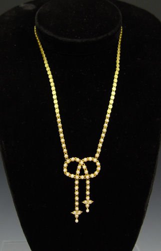 ANTIQUE 15K SEED PEARL LAVALIERE NECKLACE : ANTIQUE 18K AND SEED PEARL VICTORIAN LAVALIERE: 15K yellow gold antique seed pearl necklace. Lariat design with disc shaped links and 2.00 mm half seed pearls. Box clasp with unknown hallmarks. Weight