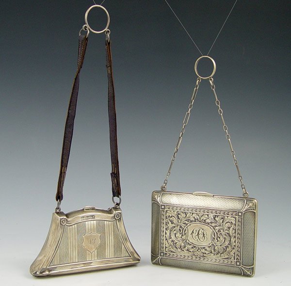2 SILVER CHATELAINE PURSES: 2 SILVER CHATELAINE PURSES: To include 1) James Deakin & Sons 1918 Chester England with engraved design, monogrammed N.S.. Leather strap. 2 1/4" x 4 1/8". 2) William B. Kerr & Co. with embossed floral