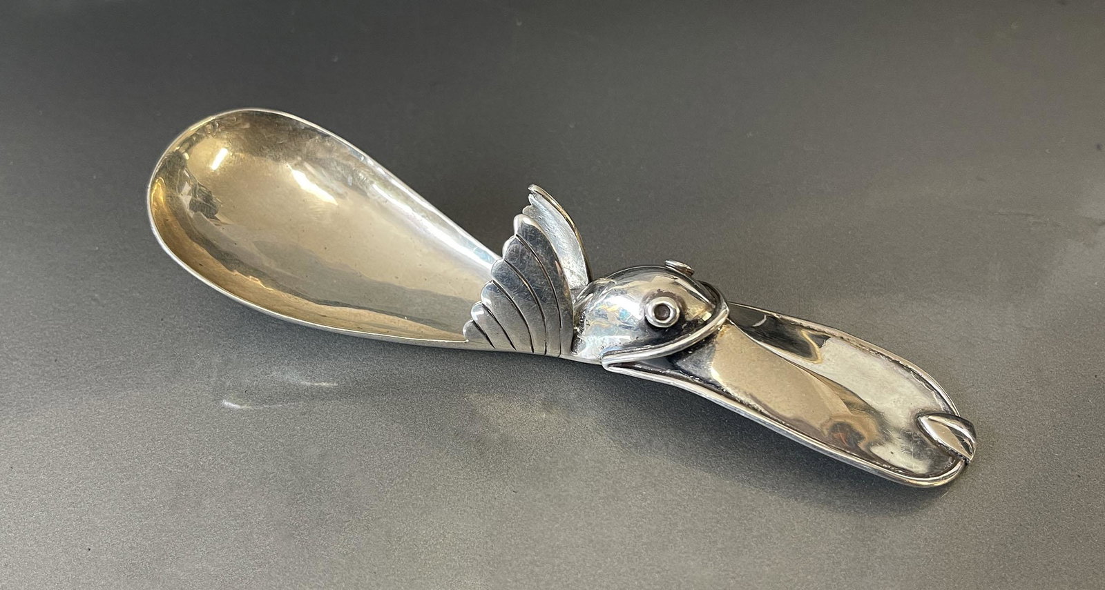WILLIAM SPRATLING STERLING AZTEC FLYING DUCK SUGAR: WILLIAM SPRATLING STERLING AZTEC FLYING DUCK SUGAR SPOON: Signed with touchmarks.
