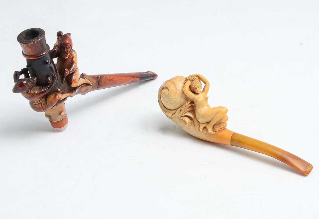 1 MEERSCHAUM & 1 BRIARWOOD PIPE: 1 MEERSCHAUM & 1 BRIARWOOD PIPE: 1) Seated nude lady Meerschaum pipe with amber mouthpiece. Nice variation in color. Measures 5.25" l and bowl is 1.5" h; 2) Fun Briarwood pipe with Elves shaping the b