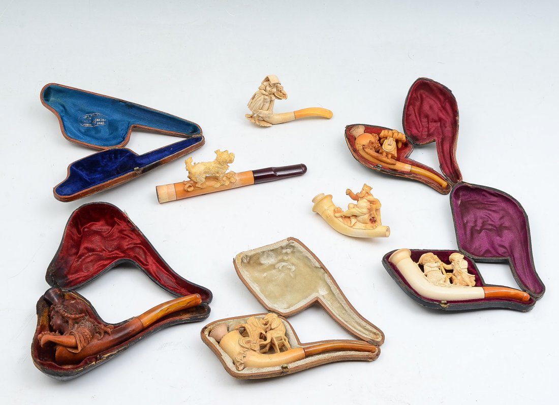7 PIECE MEERSCHAUM PIPE/CHEROOT HOLDER COLLECTION: 7 PIECE MEERSCHAUM PIPE/CHEROOT HOLDER COLLECTION: 1) Wonderful sculpted dog cased cheroot holder with amber mouthpiece, measures 6.5" l, Case reflects worn logo on blue satin; 2) Partially nude flowe