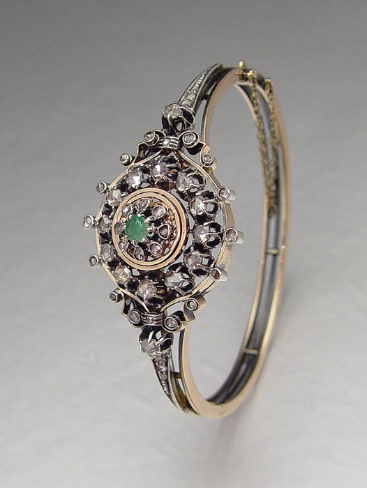 EDWARDIAN ROSE CUT DIAMOND BANGLE BRACELET: EDWARDIAN ROSE CUT DIAMOND BANGLE BRACELET: 14K yellow gold and sterling silver bangle bracelet contains forty four irregular shaped rose cut diamonds, approx. 1.00 Ct. The diamonds average SI in clar
