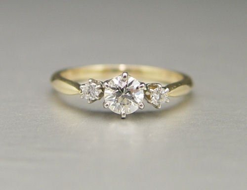 3 STONE EDWARDIAN RING 14K: 3 STONE EDWARDIAN RING: 14K yellow gold ring contains one old European round cut diamond and two round brilliant cut diamonds. Weight: .47 Ct. Approx. The diamonds average VS in clarity and H-I-J in c