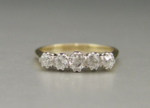 EDWARDIAN 18K & PLATINUM DIAMOND RING SIZE 6: EDWARDIAN 18K & PLATINUM DIAMOND WEDDING BAND RING: 18K and platinum ring contains five old mine cut diamonds. Weight: .75 Ct. Approx. The diamonds average VS-SI in clarity and G-H in color. The diamo
