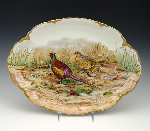 WARWICK DINNERWARE PHEASANT PLATTER: WARWICK DINNERWARE PHEASANT PLATTER: Vitrified clay, 15'l. From the private collection of the author and seen on the cover of Warwick China by John R. Rader Sr. Note scratches to surfaces.