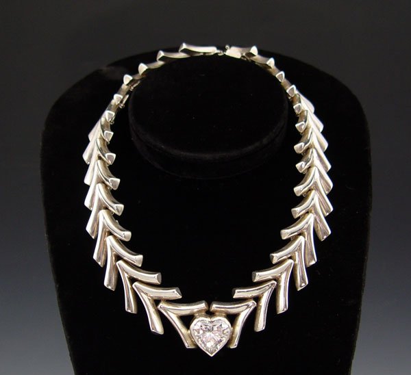 TAXCO MEXICO STERLING SILVER NECKLACE: TAXCO MEXICO STERLING SILVER NECKLACE: Chevron link collar centered by crystal in heart cut, clasp marked Sterling TN-17, approx. 16", 6.9 troy oz.