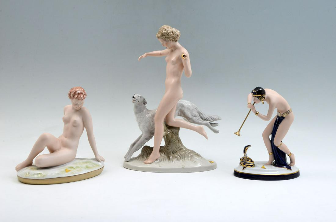 3 PC. ROYAL DUX NUDE ART DECO PORCELAIN FEMALES: 3 PC. ROYAL DUX NUDE ART DECO PORCELAIN FEMALES: Comprising; 1- Female running with dog, having a gold ball in hand. 1- Nude reclining woman on grass motif base. 1- Art deco semi-nude female Snake cha