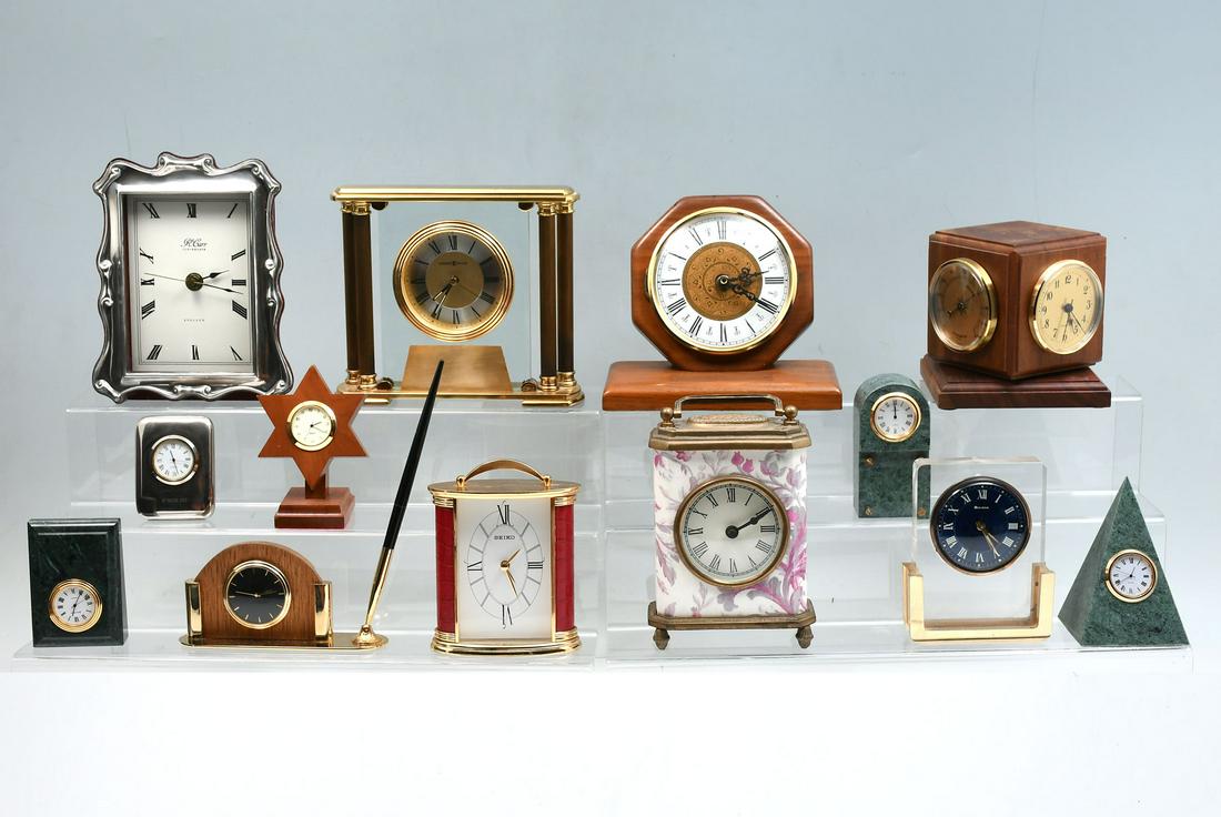13 PC. CLOCK COLLECTION INCLUDING STERLING: 13 PC. CLOCK COLLECTION INCLUDING STERLING: Comprising names such as; Seiko, Quartz, Bulova, R. Carr, & Howard Miller. Including, Brass, Marble, Glass, & Sterling clocks. Largest Approx. 6.5" h x 7.5"