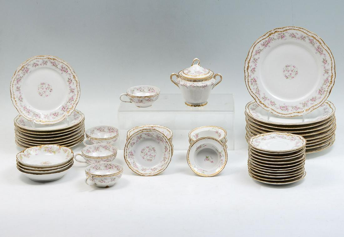 THEODORE HAVILAND LIMOGES CHINA:: THEODORE HAVILAND LIMOGES CHINA: Comprising; 10- Dinner plates, 9- Bread plates, 12- Saucers, 4- Tea cups, 4- Dessert bowls, 5- Souffle bowls, 5- Souffle under plates, & 1- Lidded sugar bowl. Largest