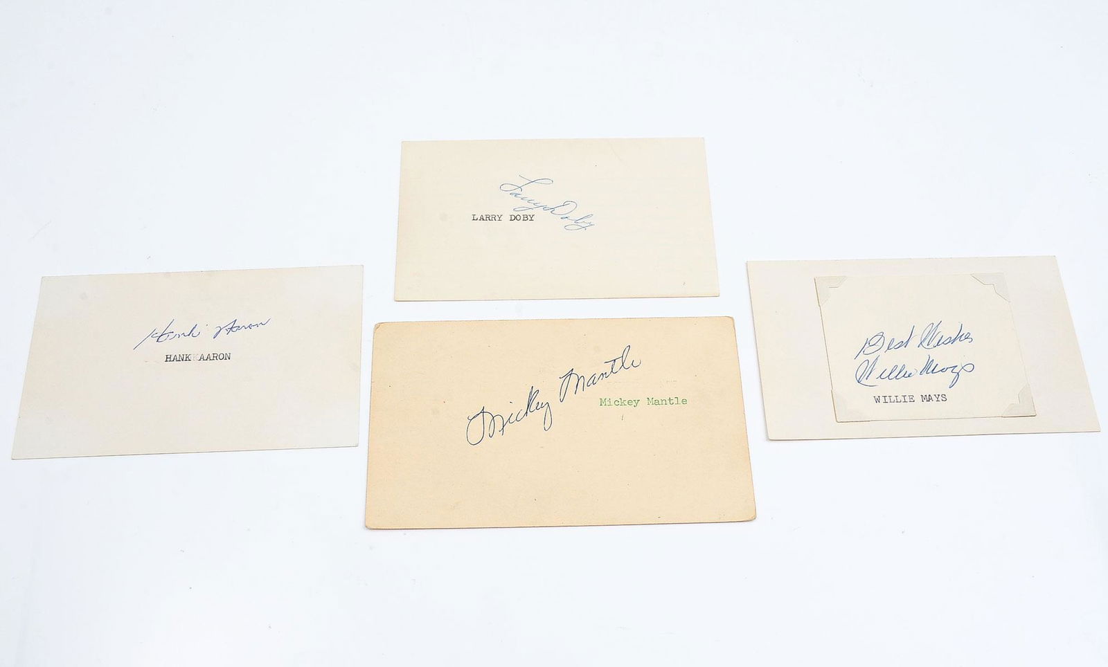 LOT OF FOUR PREMIER MAJOR LEAGUE BASEBALL PLAYER A: LOT OF FOUR PREMIER MAJOR LEAGUE BASEBALL PLAYER AUTOGRAPHS: Hank Aaron, Mickey Mantle, Willie Mays, and Larry Doby. On index cards, from the Michael Brown collection.