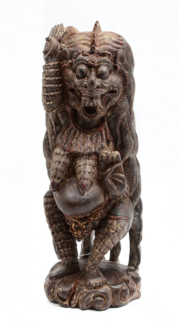 CARVED & GILT BALINESE MYTHOLOGICAL BEAST: CARVED & GILT BALINESE MYTHOLOGICAL BEAST: Early carved mythical beast, having signs of red lacquer & gilt accents. Approx. 14" h x 5" l x 5.75" w.