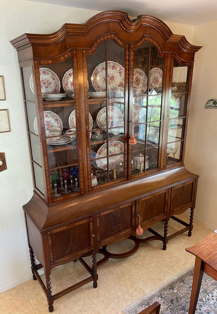 CONTINENTAL INLAID BONNET TOP BREAKFRONT: CONTINENTAL INLAID BONNET TOP BREAKFRONT: Bonnet top 2 shelf curio cabinet, having Inlaid foliate borders with floral medallions. Resting on a flared 4 door cabinet with barley twist carved legs and t