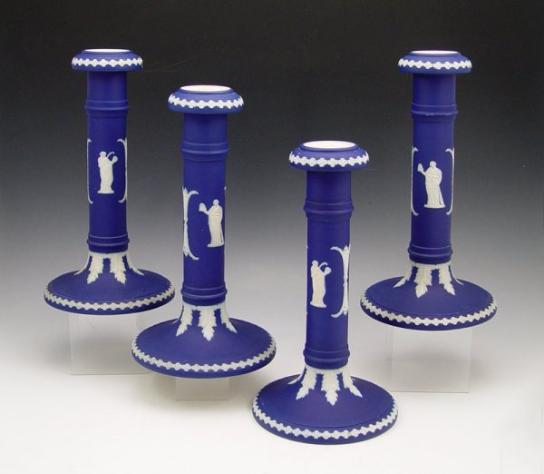 4 DUDSON BROTHERS JASPERWARE CANDLESTICKS 10'': 4 DUDSON BROTHERS JASPERWARE CANDLESTICKS: Hanley, England. White on darkest blue, 10''.