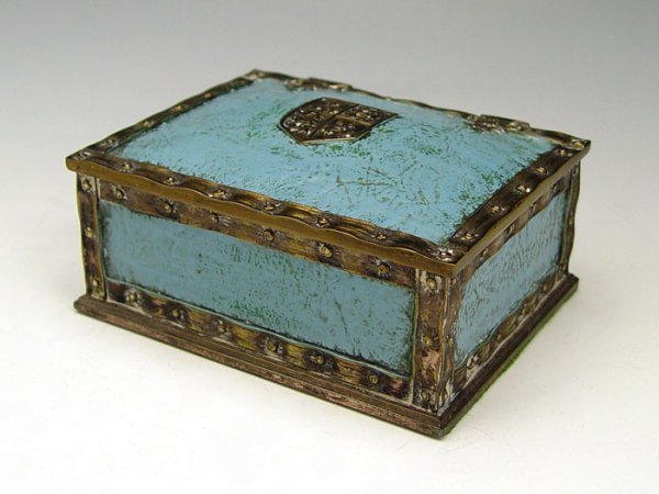 TIFFANY STUDIOS HERALDIC DESK BOX 2048: TIFFANY STUDIOS HERALDIC DESK BOX 2048: Blue faux leather with faux rivets. Hinged top, cedar lined interior, Stamped Tiffany Studios New York 2048. 2 1/4" x 4 3/4" x 3 3/4".