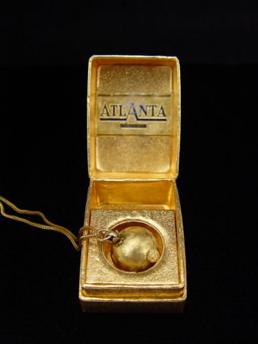 ATLANTA BALL WATCH ON CHAIN CA 1950: ATLANTA BALL WATCH ON CHAIN CA 1950: Gold plate ball watch and chain with original box. An approx. 18.5mm textured gold ball watch with Swiss 17 jewel movement, currently keeping time, original crown,