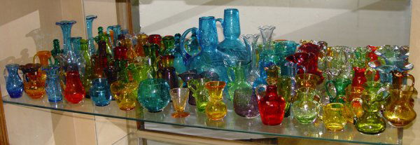 60 PIECE ESTATE COLLECTION OF CRACKLE GLASS: LARGE 60 PIECE ESTATE COLLECTION OF CRACKLE GLASS: Approx. 60 pieces in every color and shape imaginable. From the brightest orange, deepest red, purple, turquoise, and green. Vases, bottles with stop