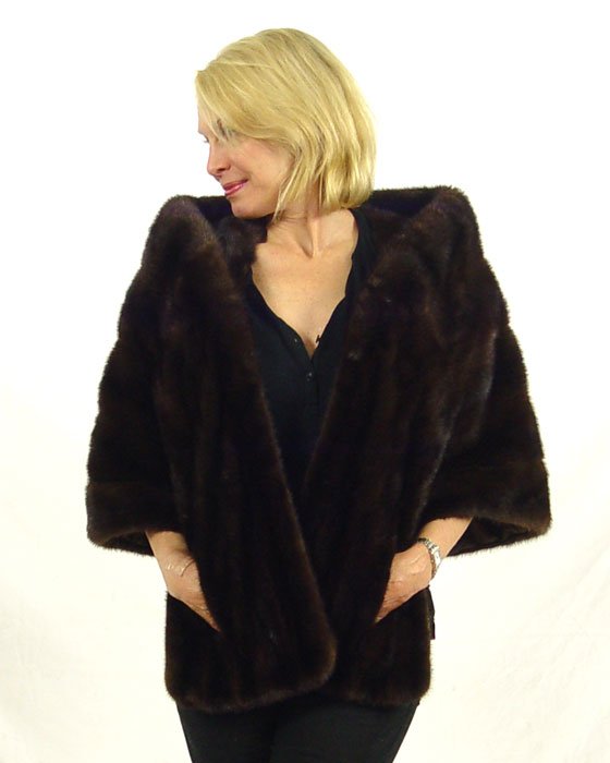 DARK CHOCOLATE BROWN MINK STOLE: DARK CHOCOLATE BROWN MINK STOLE: Unusual and flattering tucked collar. Sakowitz of Houston label. 20" length in the back and wraps around to 29" in the front.