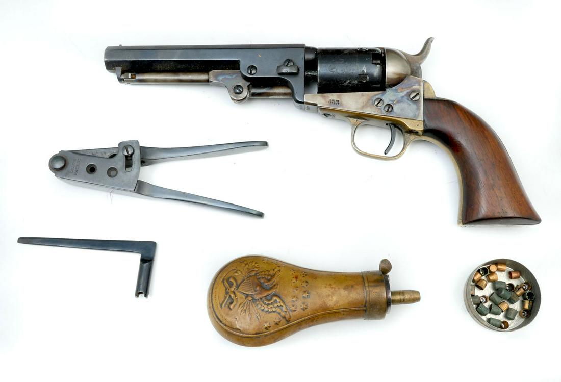 CASED COLT POCKET MODEL 1849 PISTOL: CASED COLT POCKET MODEL 1849 PISTOL: Serial #75557. Manufactured in 1853, 1849 pocket model, .31 Caliber with an etched stage coach scene at cylinder. 4.75'' octagonal barrel. All numbers match. Also