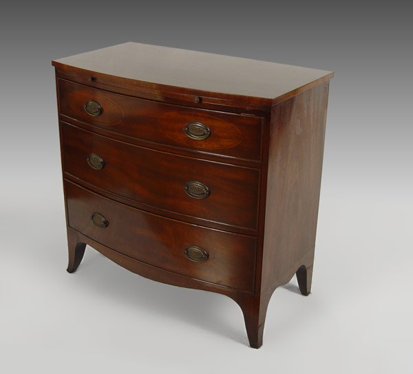 KITTINGER GAINSBOROUGH A691 MAHOGANY CHEST: KITTINGER HEPPLEWHITE STYLE SPLAYED LEG CHEST: Gainsborough Pattern A691. String inlay oval on the top of drawer of three graduated drawers with oval brass pulls. 36" wide, 18" deep, 35" tall.