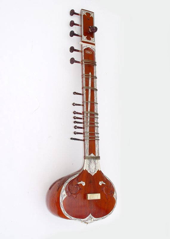 BINA 17 STRING INLAID SITAR: BINA 17 STRING INLAID SITAR: Large carved and ivory appearance inlay 17 string sitar by Bina Musical Stores, Nai Sarak, Delhi. Measures 50" l. x 16" x 14".