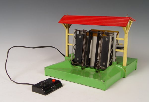 LIONEL LUMBER SHED NO 164 POST WAR: LIONEL LUMBER SHED NO 164: Post War with controller, overall 9''h. x 10 3/4'' x 10 7/8''.