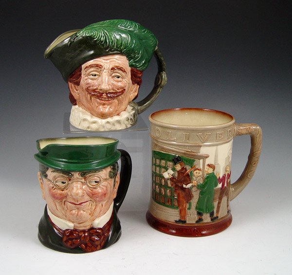 ROYAL DOULTON LG CHARACTER JUGS : 3 ROYAL DOULTON LARGE CHARACTER JUGS: To include, THE CAVALIER, A mark (possibly D6114); MR. PICKWICK (1st Version), A mark (possibly D 6060) and OLIVER TWIST, scenic tankard, (possibly D6286), 1949, 